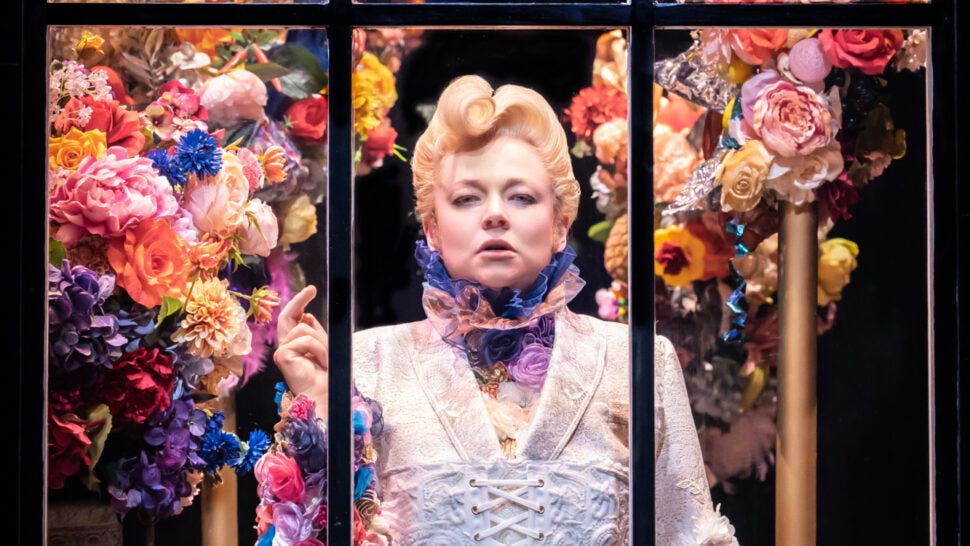 Sarah Snook in period dress as Dorian Gray, surrounded by flowers Sarah Snook in period dress as Dorian Gray, surrounded by flowers
