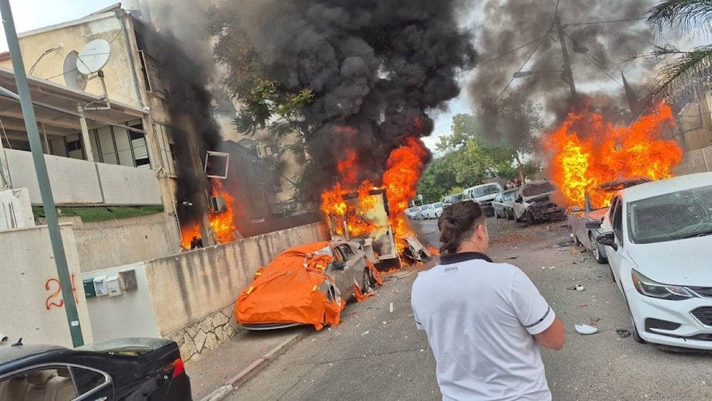 Fires erupt in Haifa, northern occupied Palestine, following a heavy rocket barrage from Hezbollah on November 11, 2024 (Social media) Fires erupt in Haifa, northern occupied Palestine, following a heavy rocket barrage from Hezbollah on November 11, 2024 (Social media)