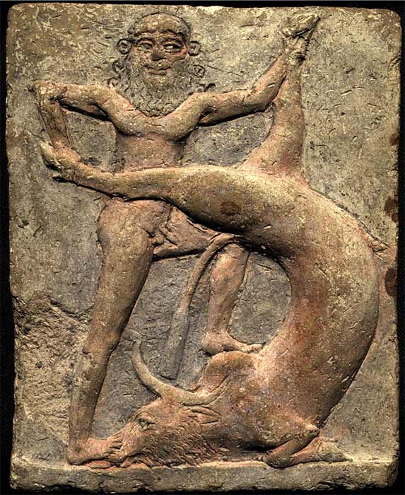 Ancient Mesopotamian terracotta relief (c. 2250 — 1900 BC) showing Gilgamesh slaying the Bull of Heaven, an episode described in Tablet VI of the Epic of Gilgamesh (Public Domain)