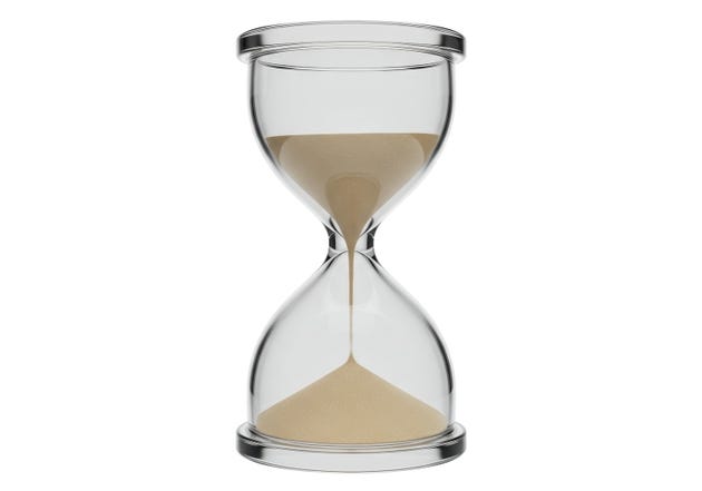Isolated Sand Falling Through Hourglass Time Passing