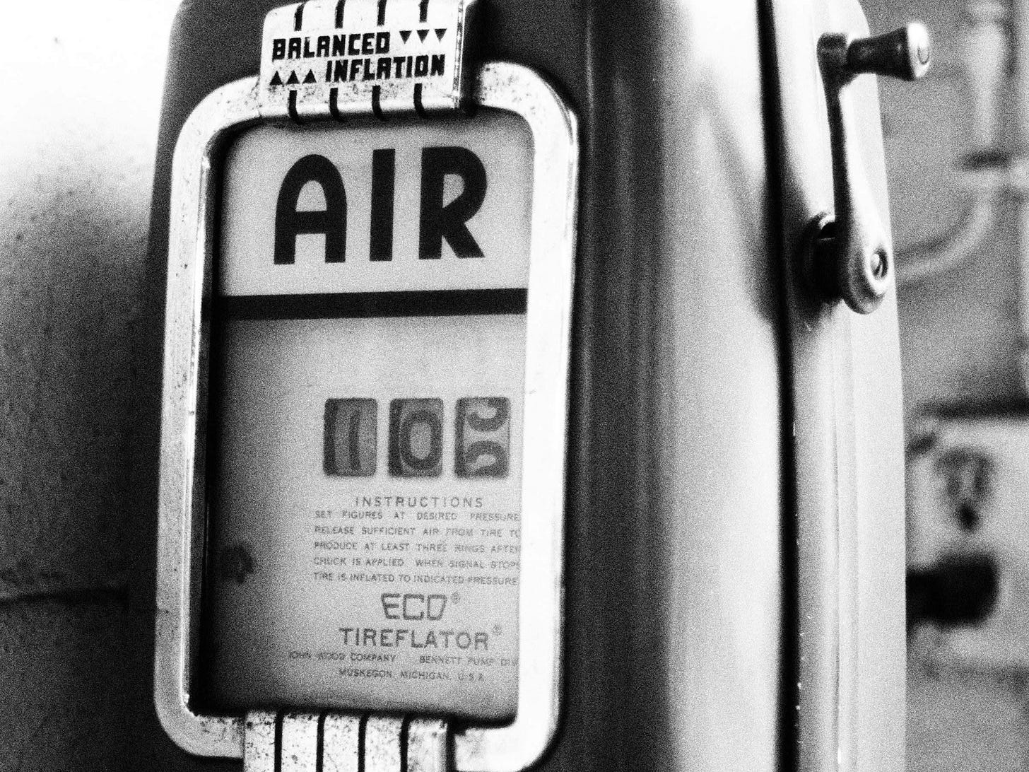 a black and white photo of an air meter a black and white photo of an air meter