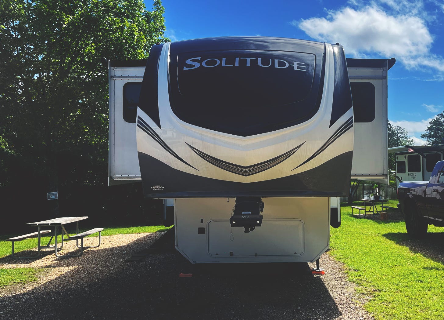 an RV called solitude parked in a campsite