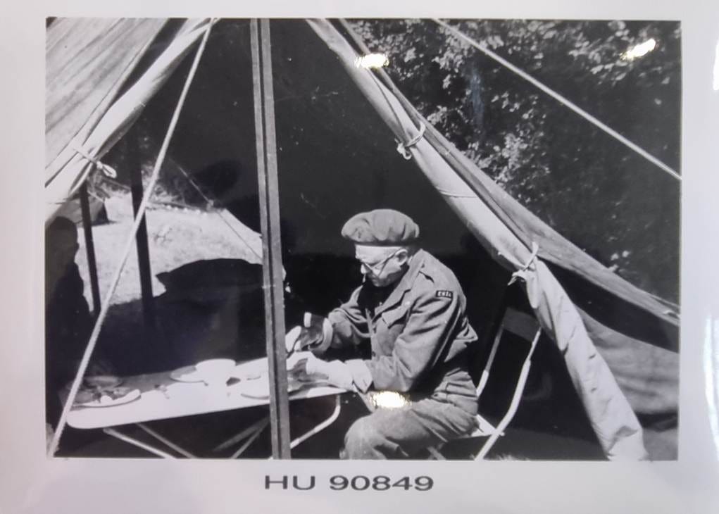 A person sitting in a tent

AI-generated content may be incorrect.