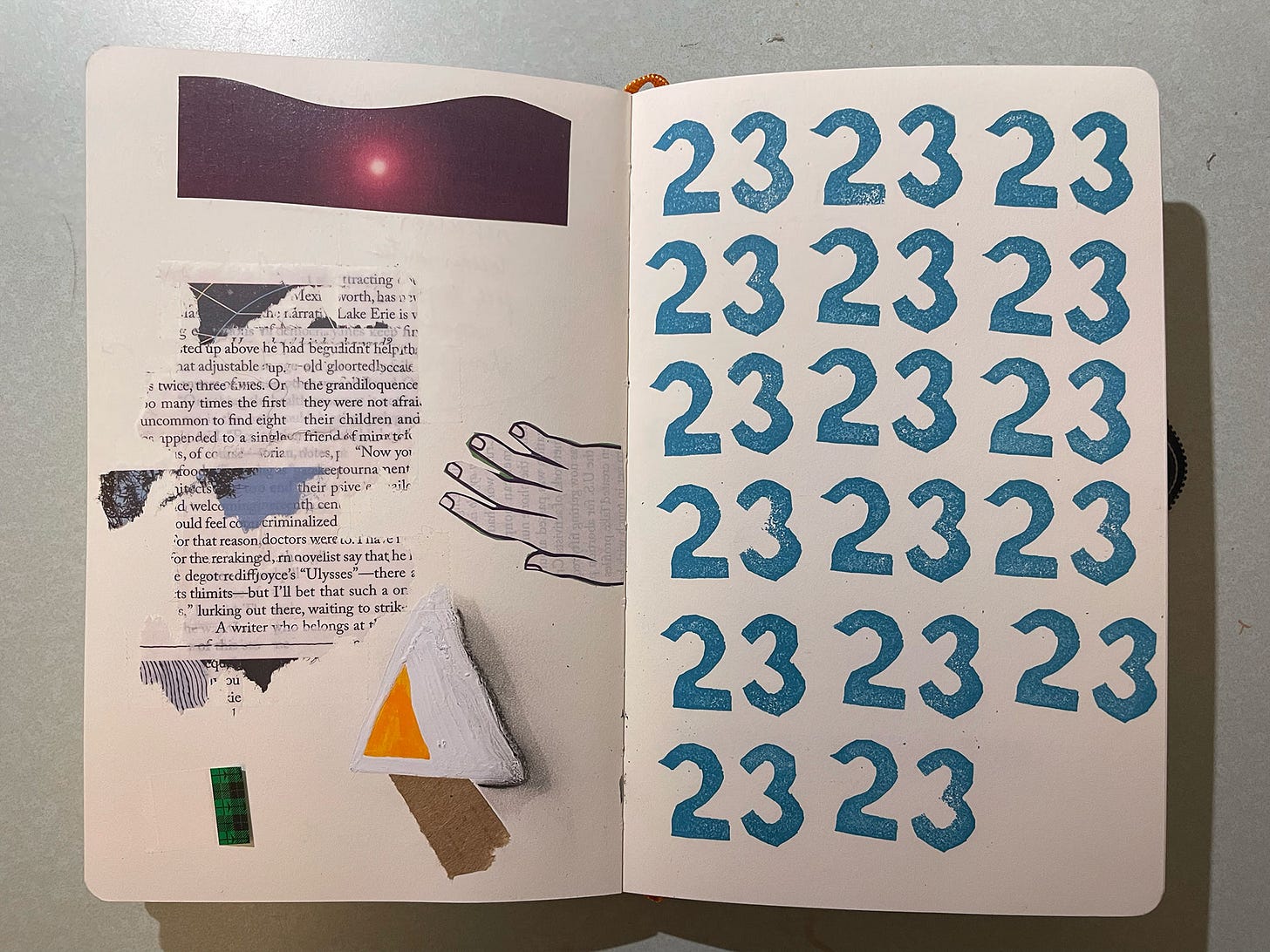 Sketchbook page with collage and writing