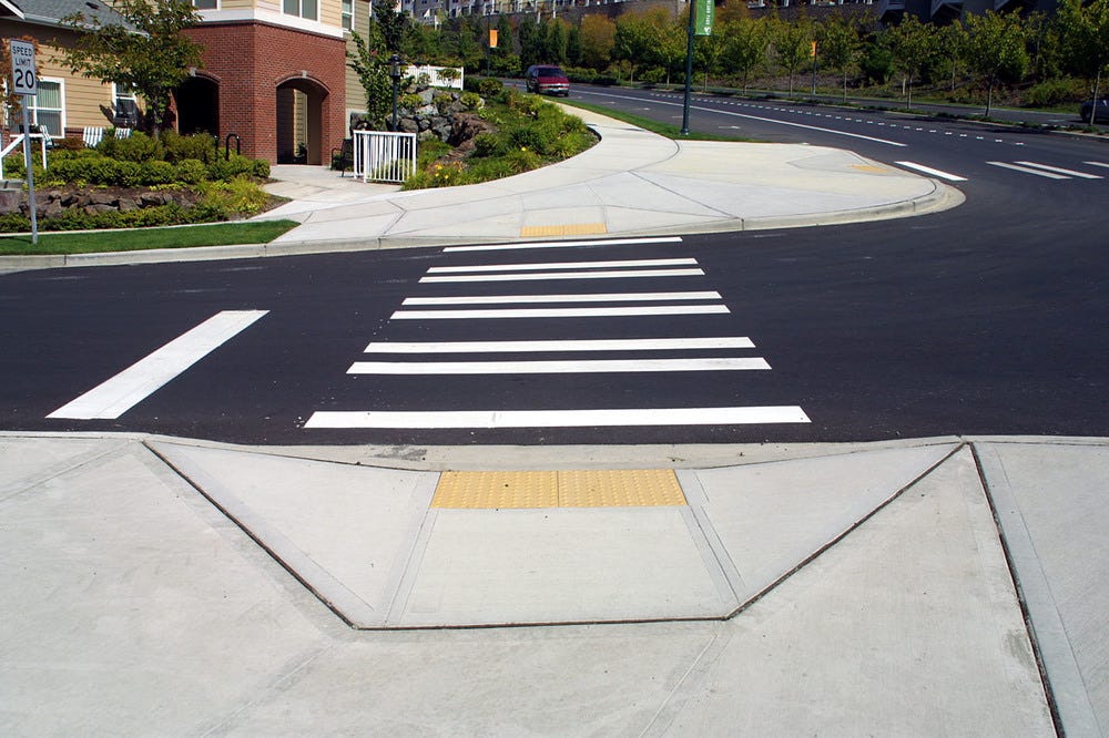a pedestrian crossing a pedestrian crossing