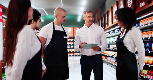 Store Manager In Supermarket Meeting With Team Store Manager In Supermarket Meeting With Team. Management Planning mulltiple retail store employees stock pictures, royalty-free photos & images Store Manager In Supermarket Meeting With Team Store Manager In Supermarket Meeting With Team. Management Planning mulltiple retail store employees stock pictures, royalty-free photos & images