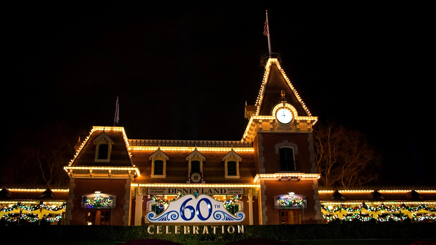 Main Street Station at Disneyland lit for the holidays during an earlier season. Image: HarshLight via Wikimedia Commons