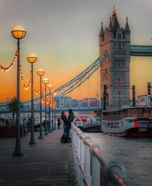 May be an image of 4 people and Tower Bridge