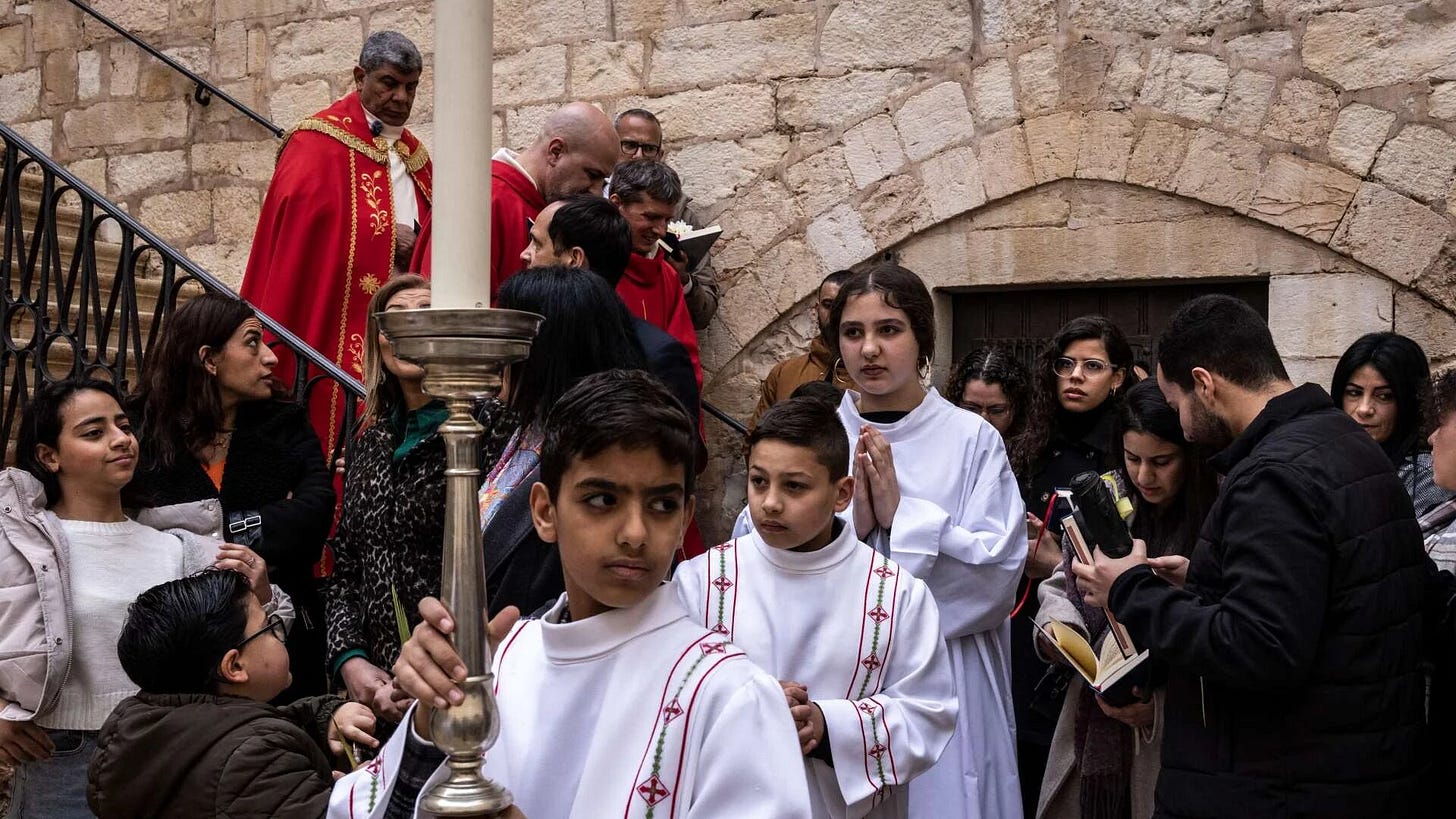 A Palm Sunday procession leaves the Catholic Franciscan Monastery of Saint Saviour in the Old City of Jerusalem, Palestine on 29 March 2026