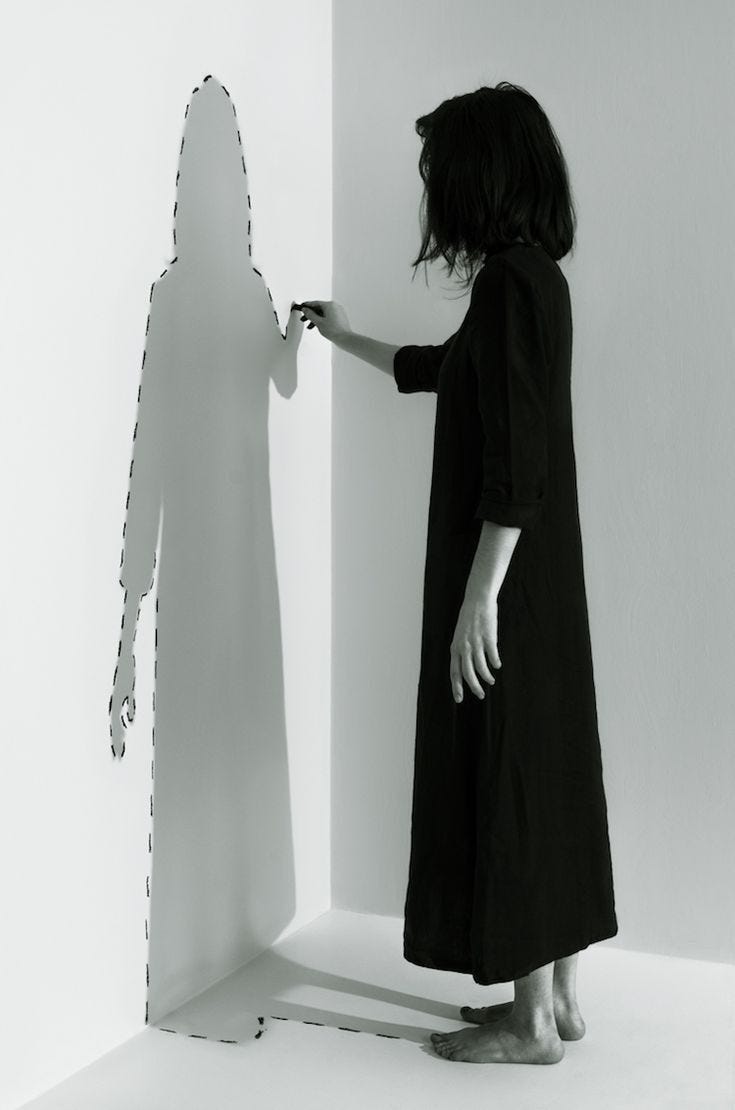 This may contain: a woman standing next to a cut out of a person