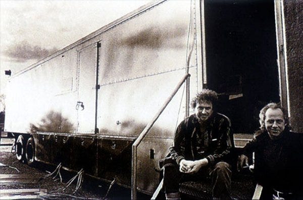 Ahern with Mark Knoplfer of the Dire Straits outside of the Enactron Truck