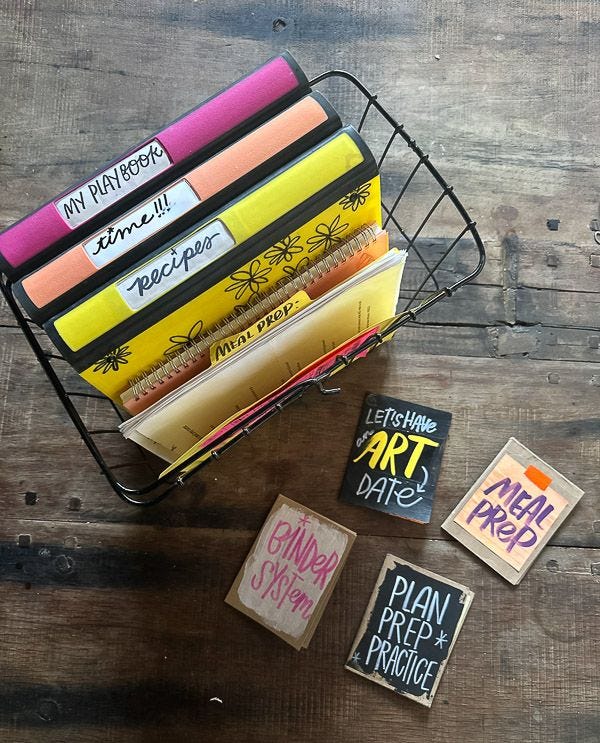 This may contain: several books are stacked on top of each other in a wire basket next to some magnets