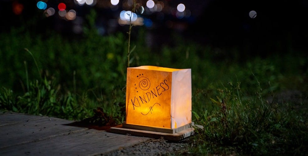 a paper bag with writing on it sitting on the ground