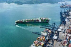 Ariel view of cargo container ships at port.