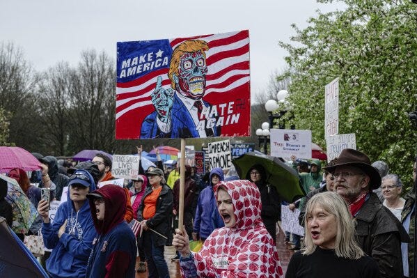 Protesters shout during a "Hands Off!" protest against President Donald Trump on the grounds of the Kentucky Capitol, Saturday, April 5, 2025, in Frankfort, Ky. (AP Photo/Jon Cherry)