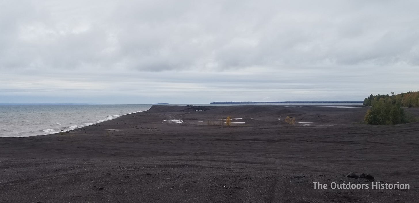 Looking south toward the mouth of the Traverse River shows an expanse of black stamp sands.