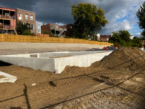 Photos of construction progress, volunteers working on site.