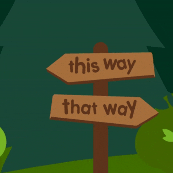 Wooden crossroads near a  forest reading this way and that way