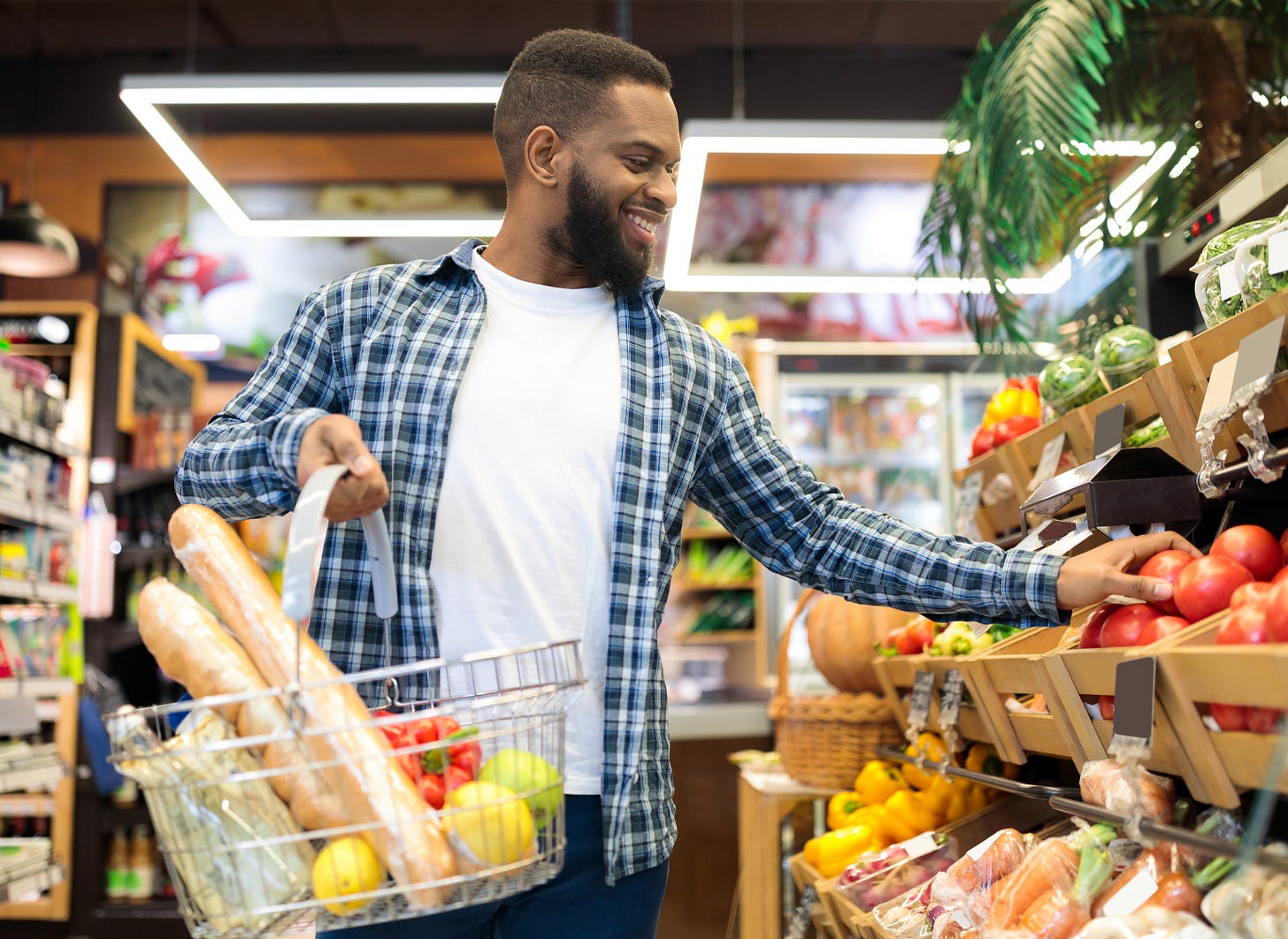 A young man shopping with his LifeMart benefits.