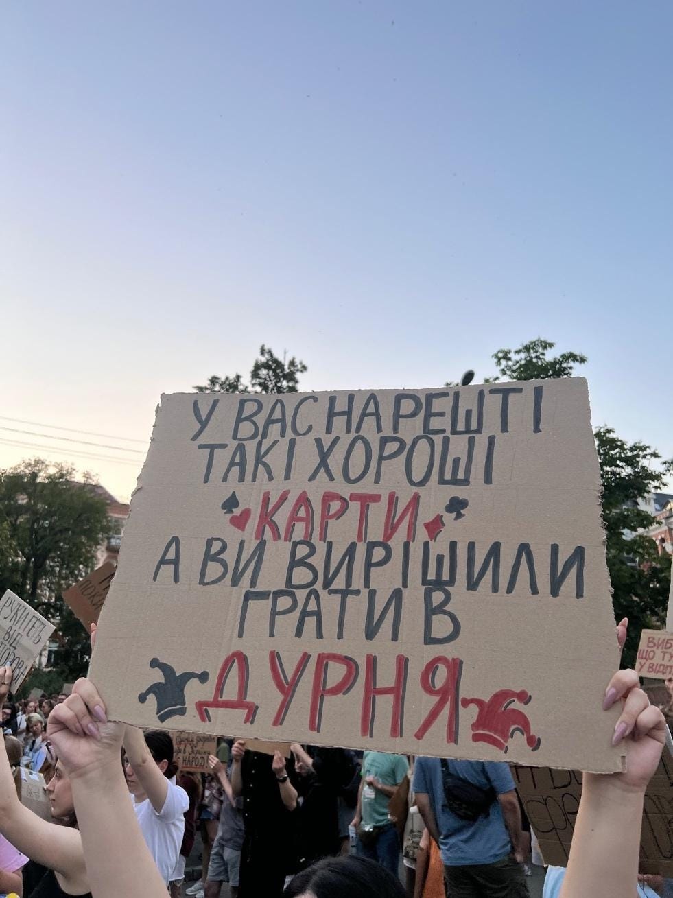 A group of people holding up a sign

AI-generated content may be incorrect.
