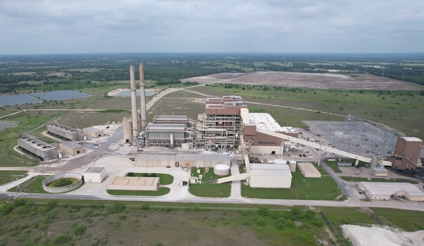 Coal plant site shot from above, with grass and trees to the horizon Coal plant site shot from above, with grass and trees to the horizon