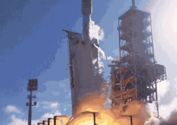 a rocket is being launched into the sky with smoke coming out of it