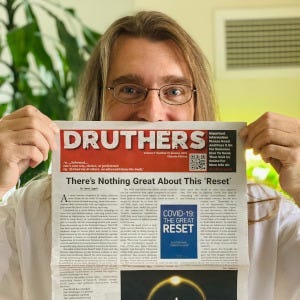 A person holding a newspaper

Description automatically generated