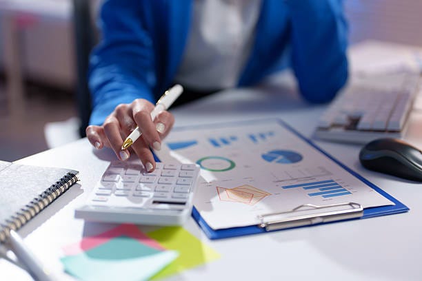 Close-up of a businesswoman's hands using a calculator and analyzing financial charts, showcasing data analysis and financial planning in a professional setting Close-up of a businesswoman's hands using a calculator and analyzing financial charts, showcasing data analysis and financial planning in a professional setting balance sheet stock pictures, royalty-free photos & images Close-up of a businesswoman's hands using a calculator and analyzing financial charts, showcasing data analysis and financial planning in a professional setting Close-up of a businesswoman's hands using a calculator and analyzing financial charts, showcasing data analysis and financial planning in a professional setting balance sheet stock pictures, royalty-free photos & images