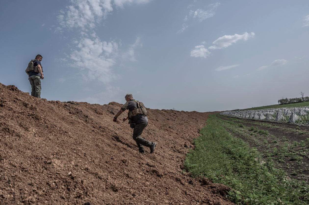 Ukrainian soldiers inspect new defensive fortifications in Donbas. Ukrainian soldiers inspect new defensive fortifications in Donbas.