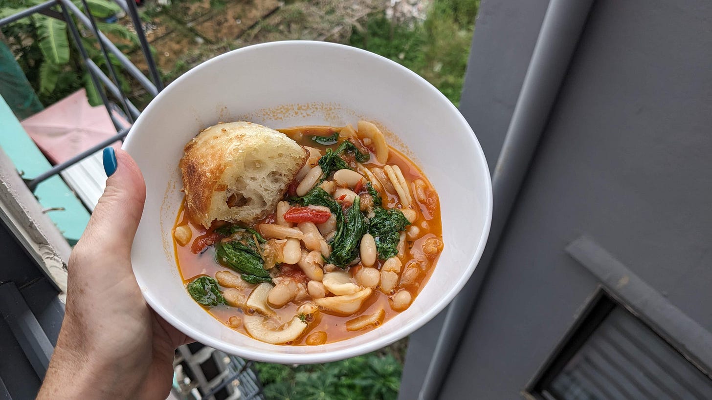 bowl of pasta and beans and greens