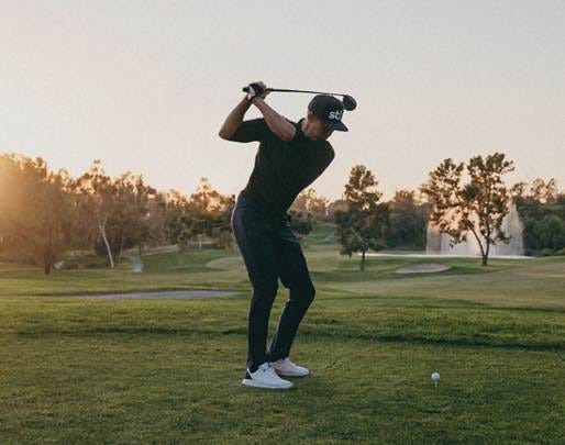A person swinging a golf club

AI-generated content may be incorrect.