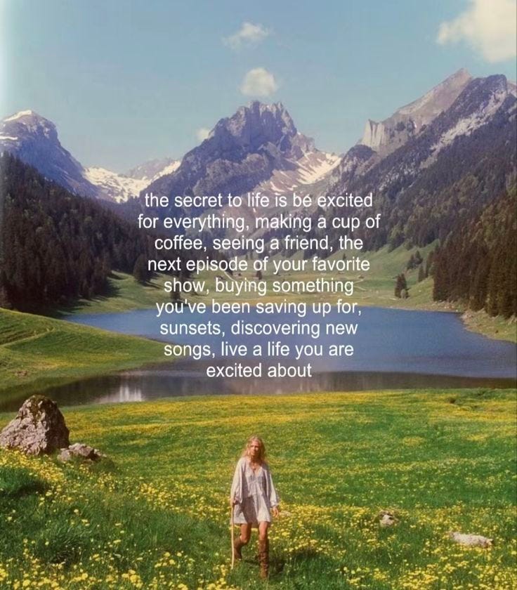 This may contain: a woman standing on top of a lush green field next to a lake and mountains