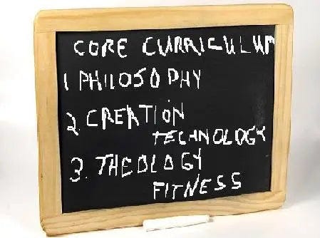 Blackboard says, “Monkey + Man = Atheist” and “Jesus good; Satan bad” and “Darwin Sucks.”