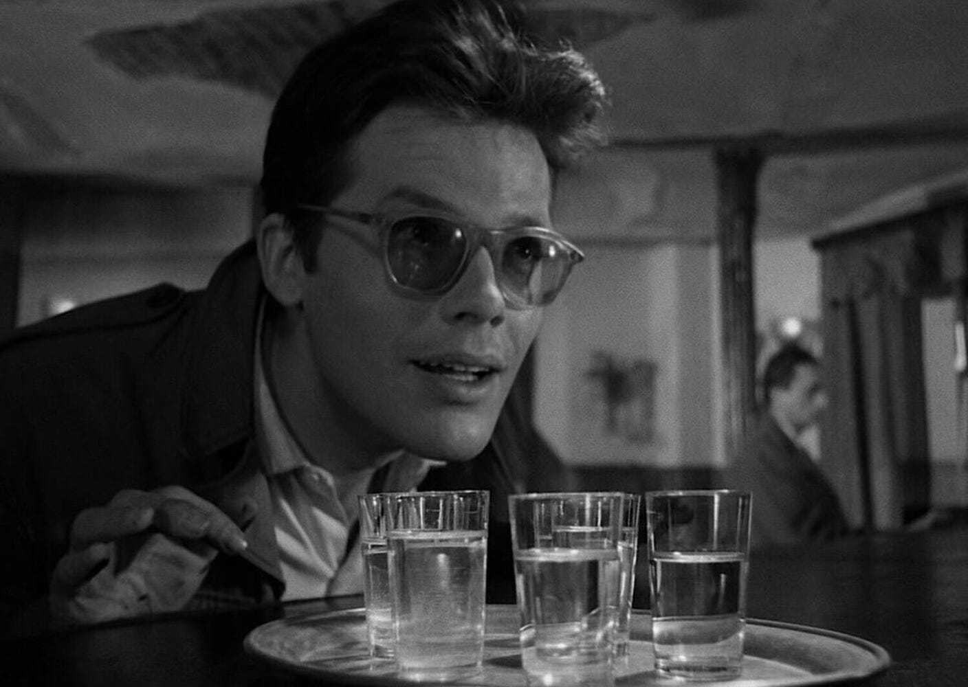 Maciek (Zbigniew Cybulski), having just poured out several shot glasses representing fallen comrades, in one of the most powerful symbolic moments in 'Ashes and Diamonds' ('Popiół i diament').