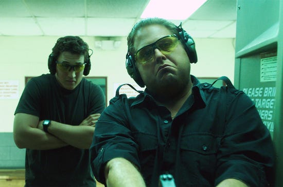 Gunrunners David Packouz (Miles Teller) and Efraim Diveroli (Jonah Hill) test the goods in "War Dogs," a 2016 comedy-drama from Warner Brothers. Gunrunners David Packouz (Miles Teller) and Efraim Diveroli (Jonah Hill) test the goods in "War Dogs," a 2016 comedy-drama from Warner Brothers.
