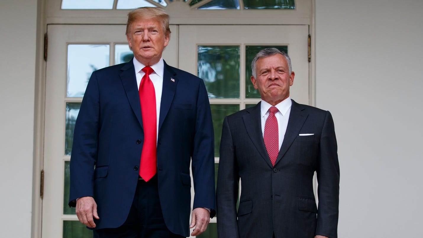 President Donald Trump stands with Jordan’s King Abdullah II at the White House in 2018 (Evan Vucci/AP)