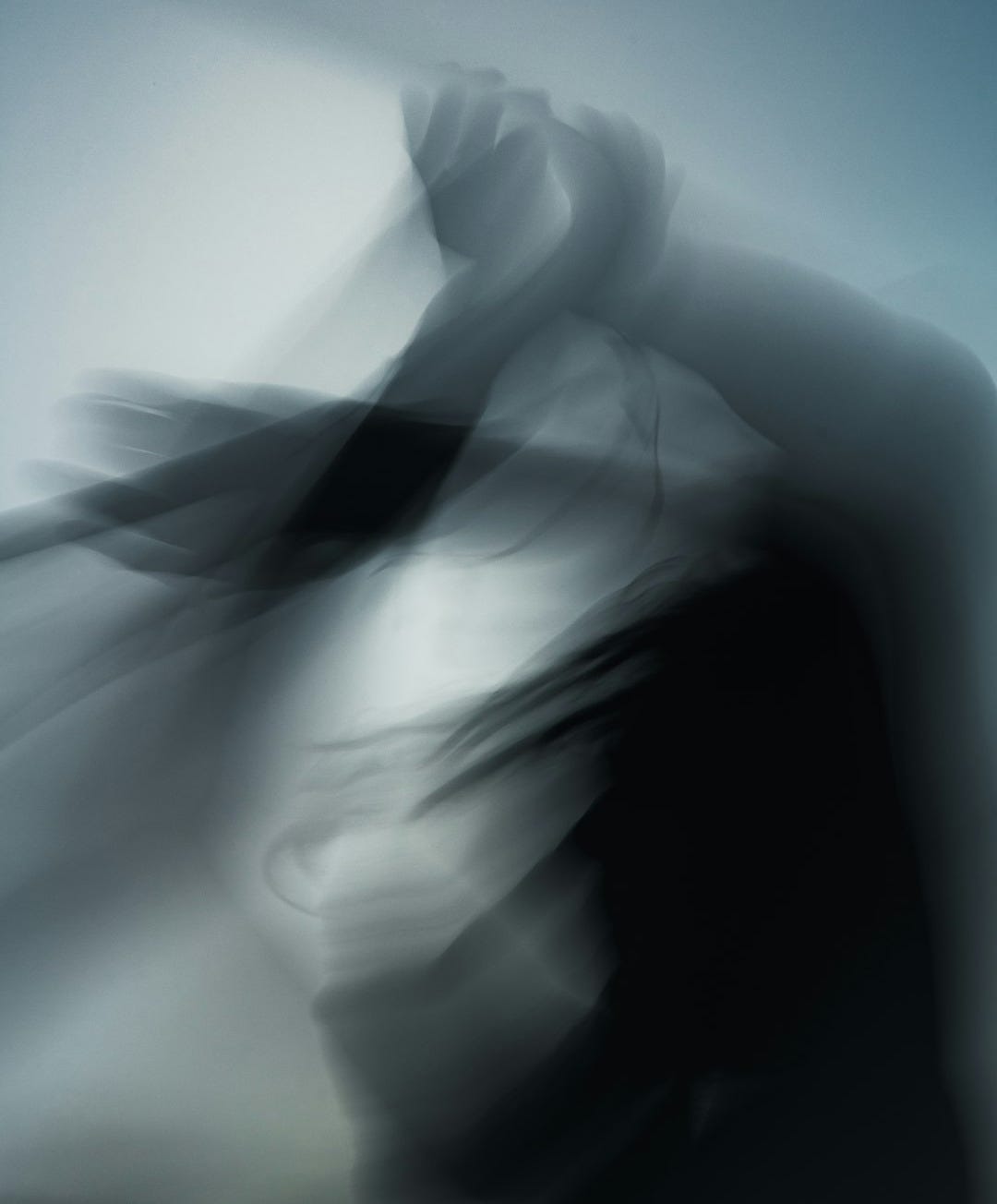 a blurry photo of a person with a hat on