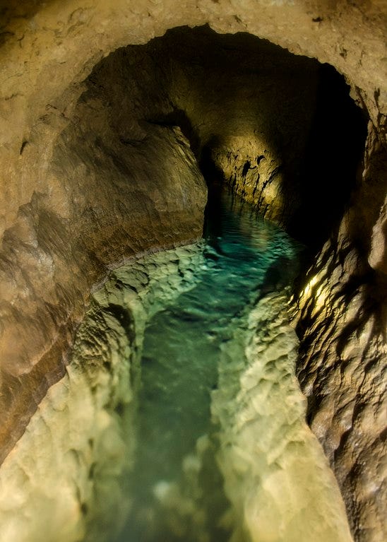 "Follow the water," they said.  "You'll eventually get to civiliation," they said.  But water only flows downhill, and they didn't mention which civilization.