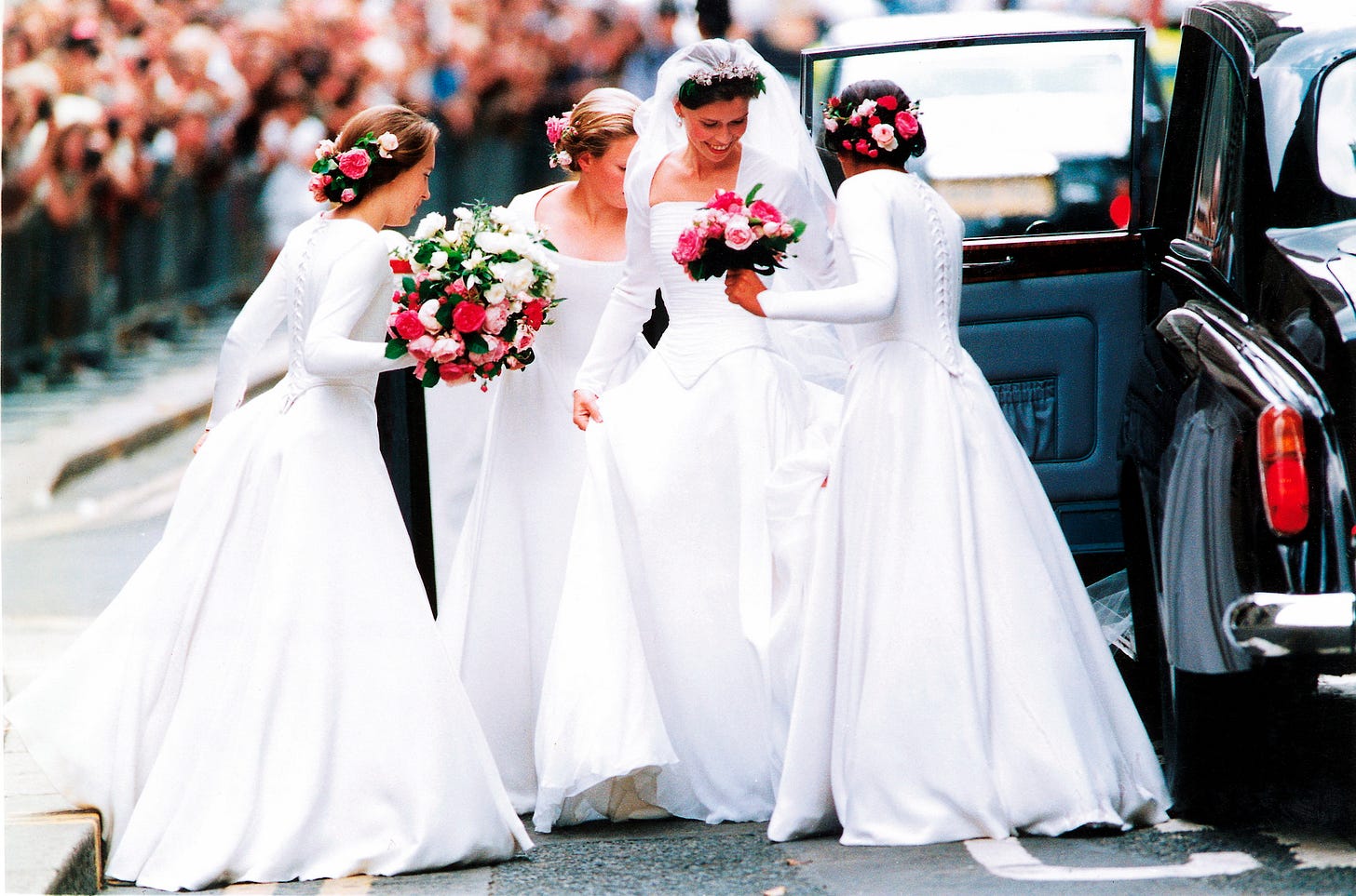 Lady Sarah's Chatto getting out of her wedding car with her bridesmaids