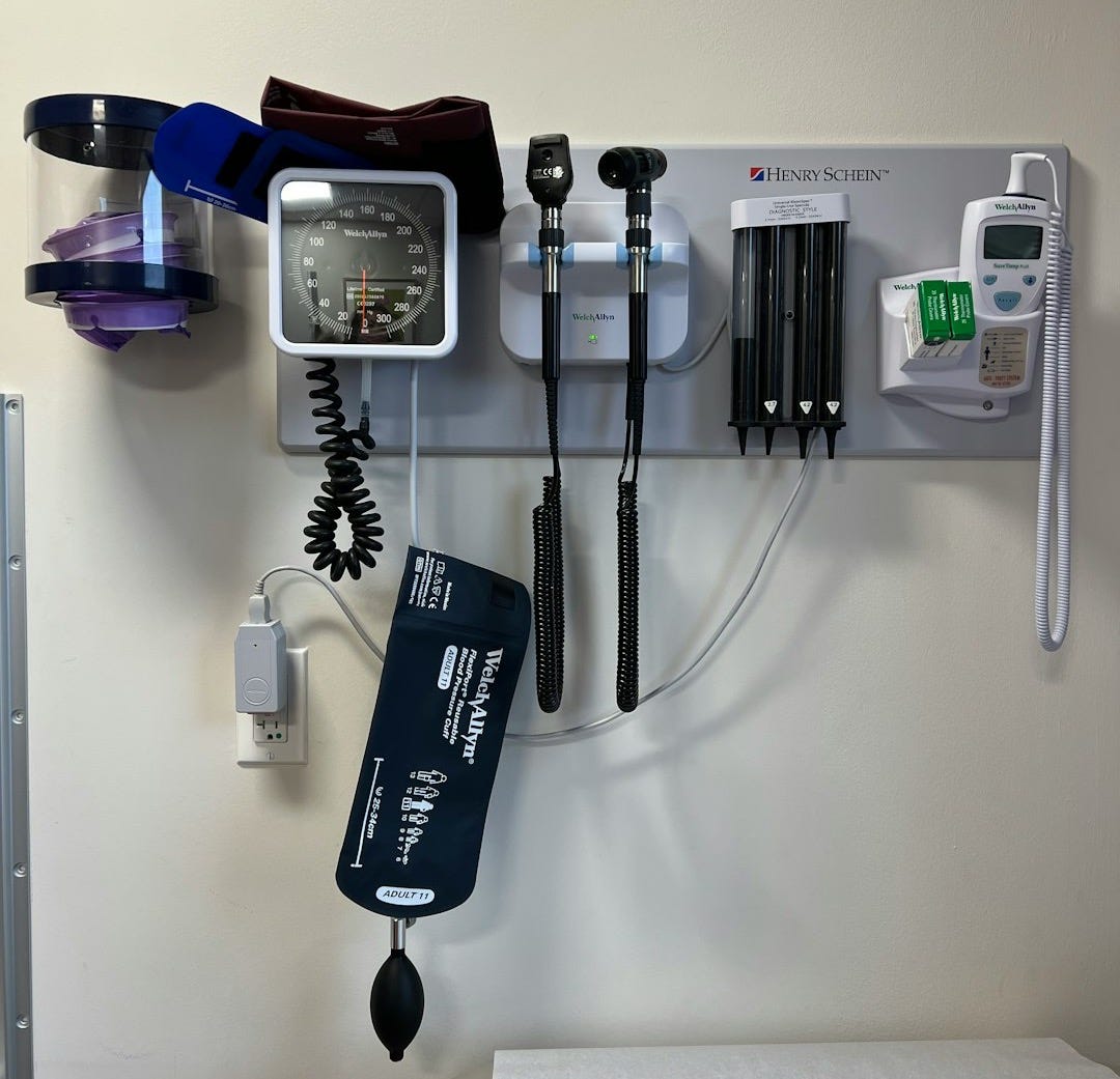 a wall with a wall of electronic devices and a phone on it