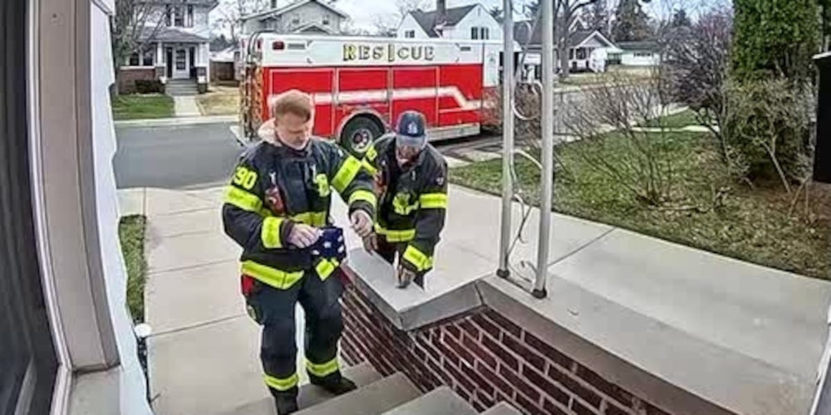 Firefighters fold and return American flag to homeowner's porch