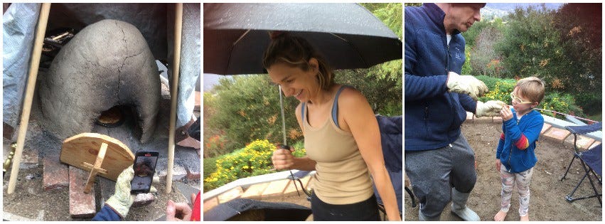 earthen pizza oven, a woman laughing under an umbrella, a man giving a piece of pizza to a boy