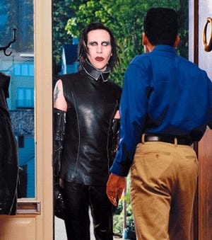 Manson knocks on a door in Grosse Pointe Farms, MI.