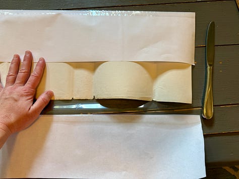 Steps 1-9 described below for how to wrap the Three Cities of Bells dust jacket in a mylar cover
