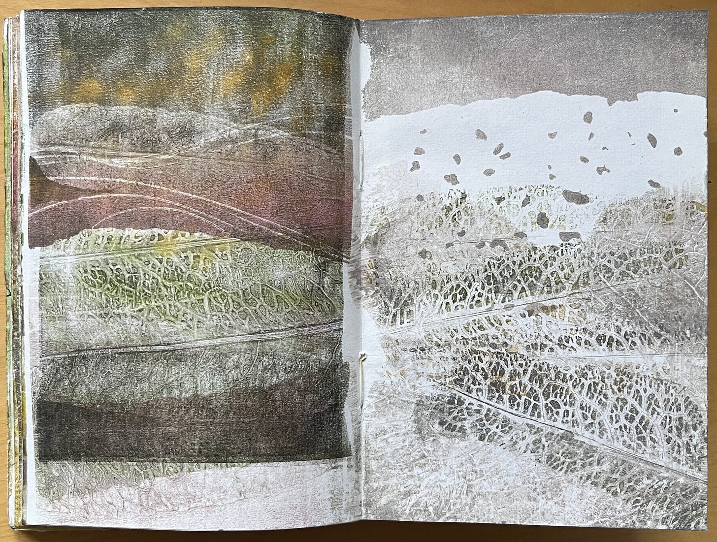 Monoprints of dock leaves arranged to resemble landscapes of rolling hills