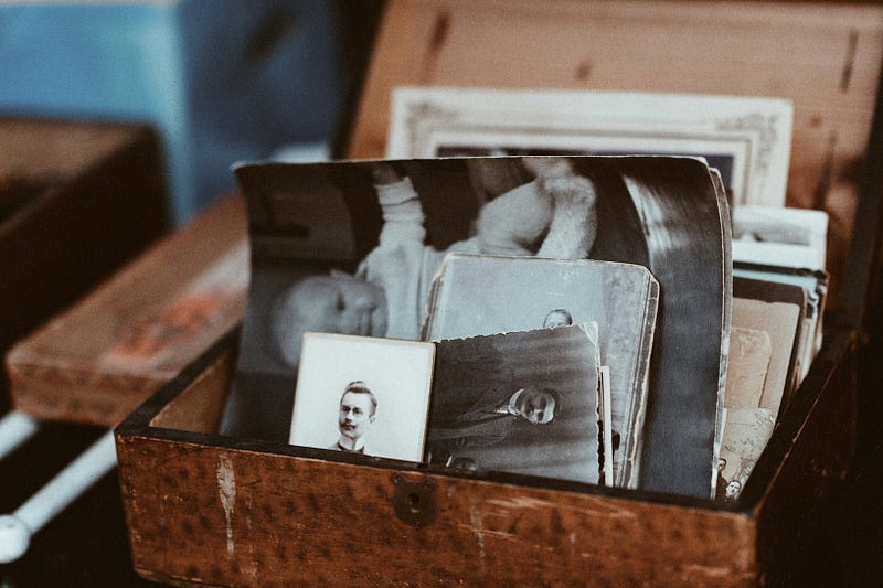 Image of a box with old black and white photos from the past. Image of a box with old black and white photos from the past.