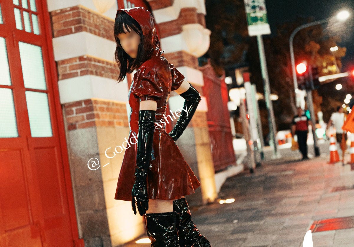 Singapore Professional Dominatrix Goddess Ashley wearing a red latex dress