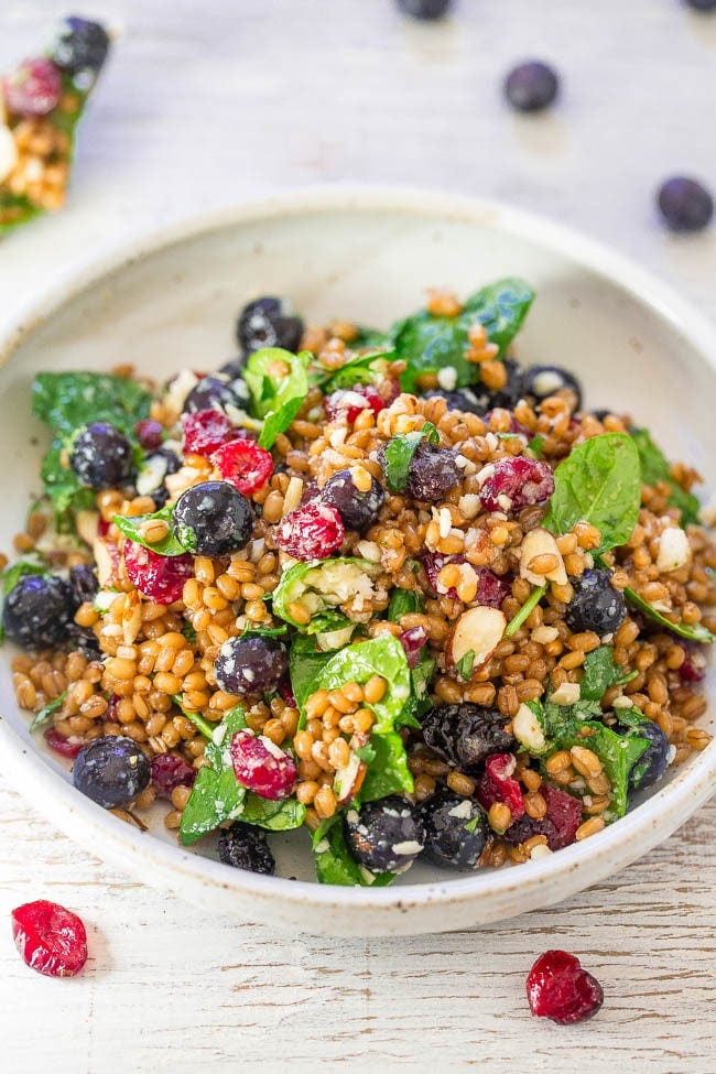 Spinach Blueberry Superfoods Salad with wheat berries in a bowl. Spinach Blueberry Superfoods Salad with wheat berries in a bowl.