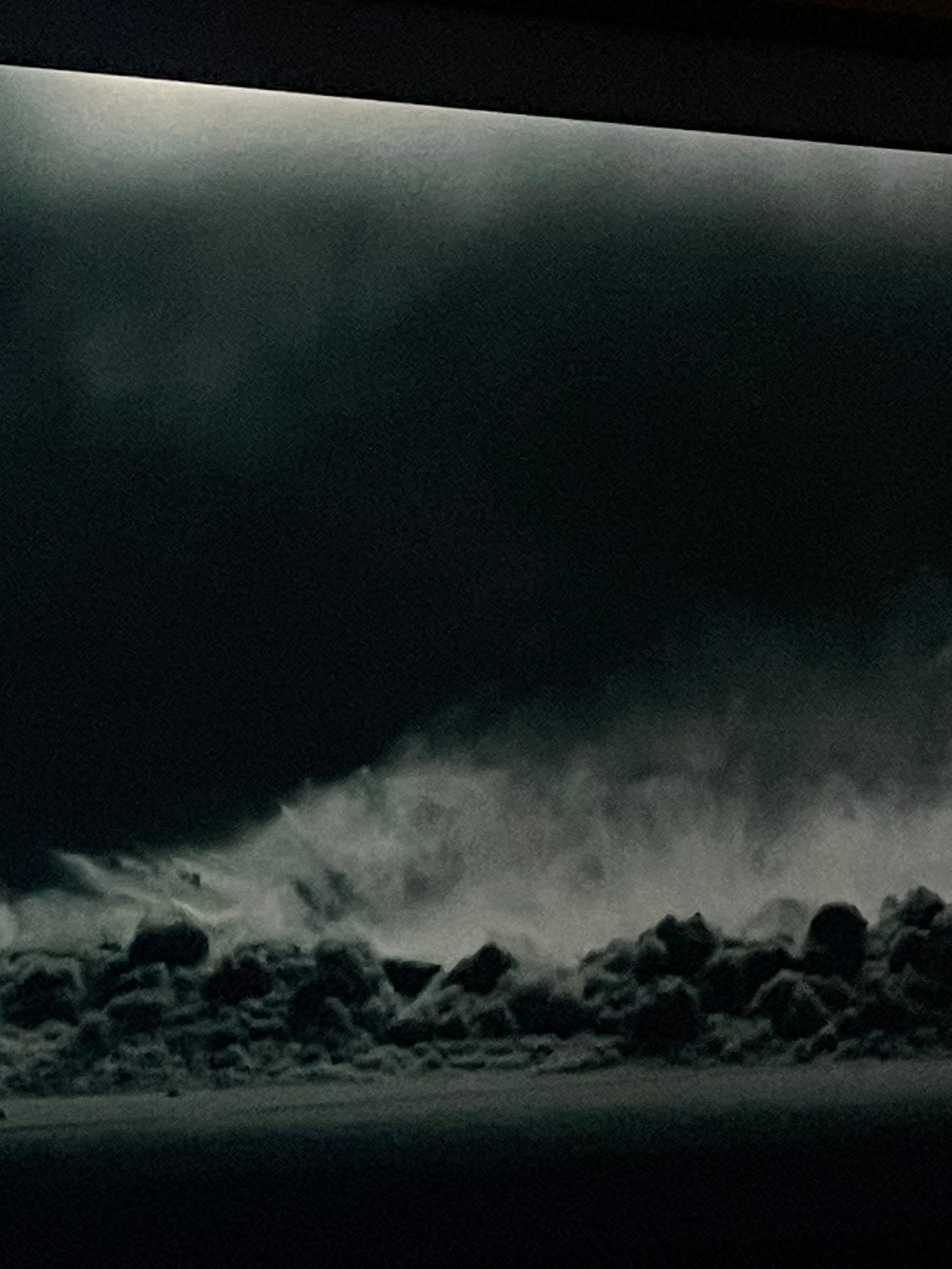 Black and white vision of the walls of the underworld and clouds of gas