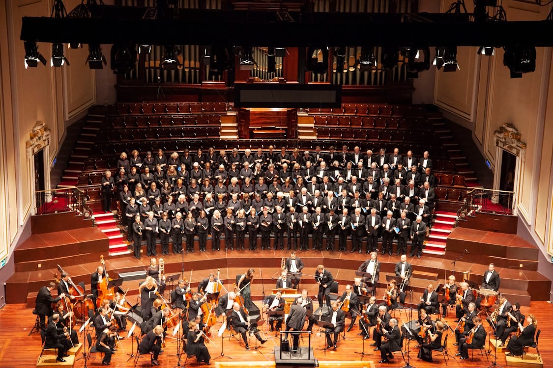 Free A majestic orchestra and choir performing at a historic venue in Edinburgh, Scotland. Stock Photo
